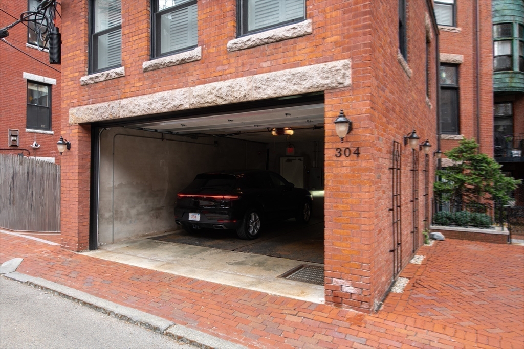 304 Commonwealth Avenue, Unit PH Boston, MA 02115 - Photo 41 of 42 a car parked in front of a building