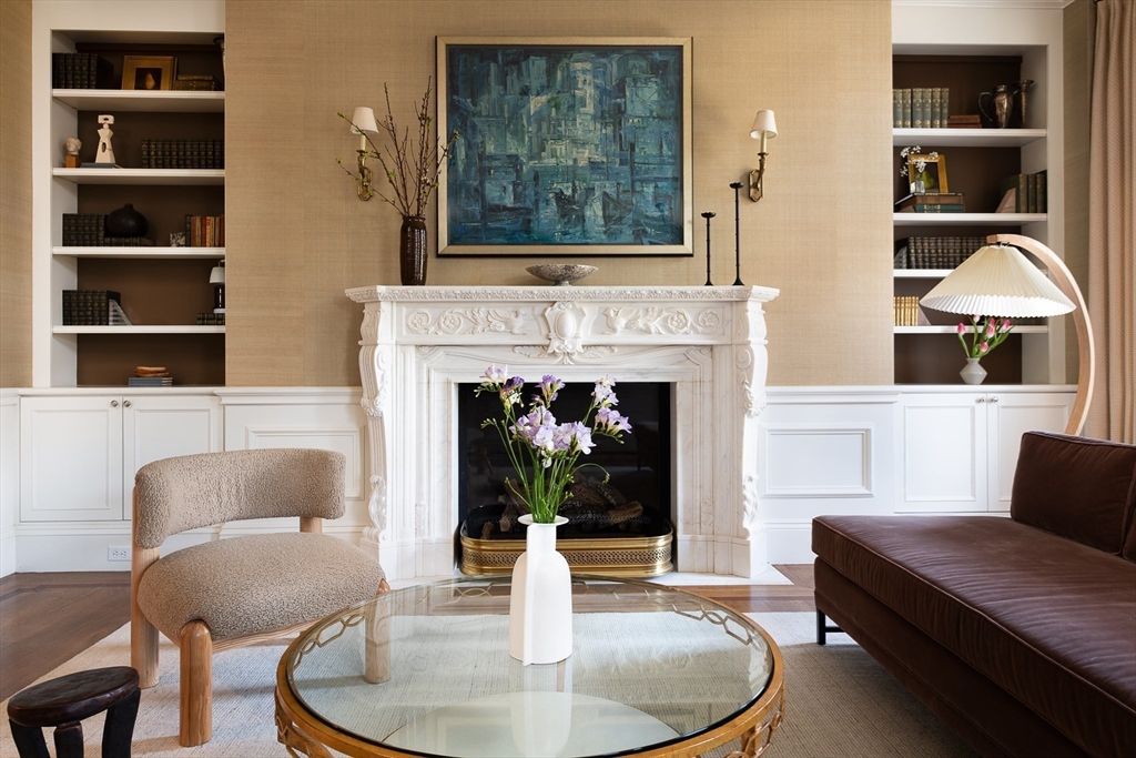304 Commonwealth Avenue, Unit PH Boston, MA 02115 - Photo 7 of 42 a living room with furniture and a fireplace