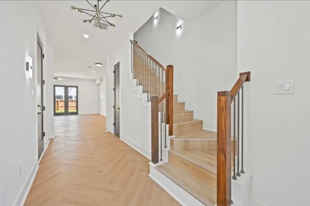 a view of a hallway with a chandelier