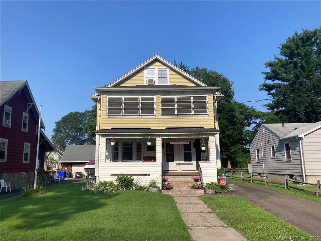 317 Garden Street Wethersfield, CT 06109 - Photo 1 of 14 a front view of a house with a yard