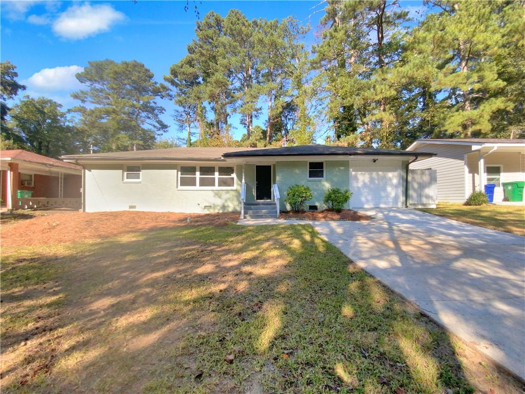 1879 Shamrock Drive Decatur, GA 30032 - Photo 1 of 1 a front view of a house with garden