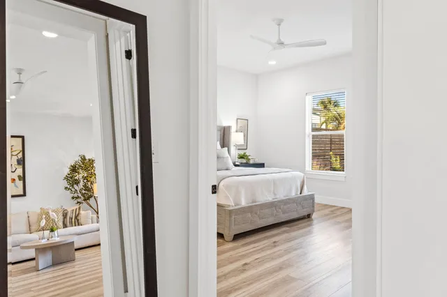a bathroom with a white bath tub sitting next to a shower