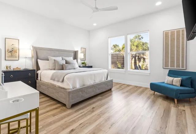 a bathroom with a double vanity sink mirror and shower