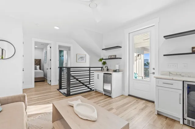 a spacious bedroom with a bed and a dresser