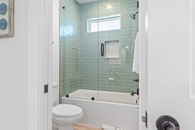 a bathroom with double sink and a mirror