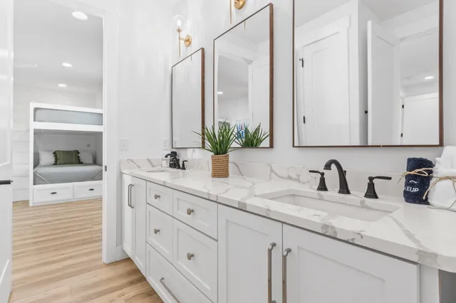 a living room with furniture floor to ceiling window and a flat screen tv