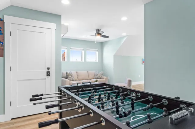 a view of a house with backyard and sitting area