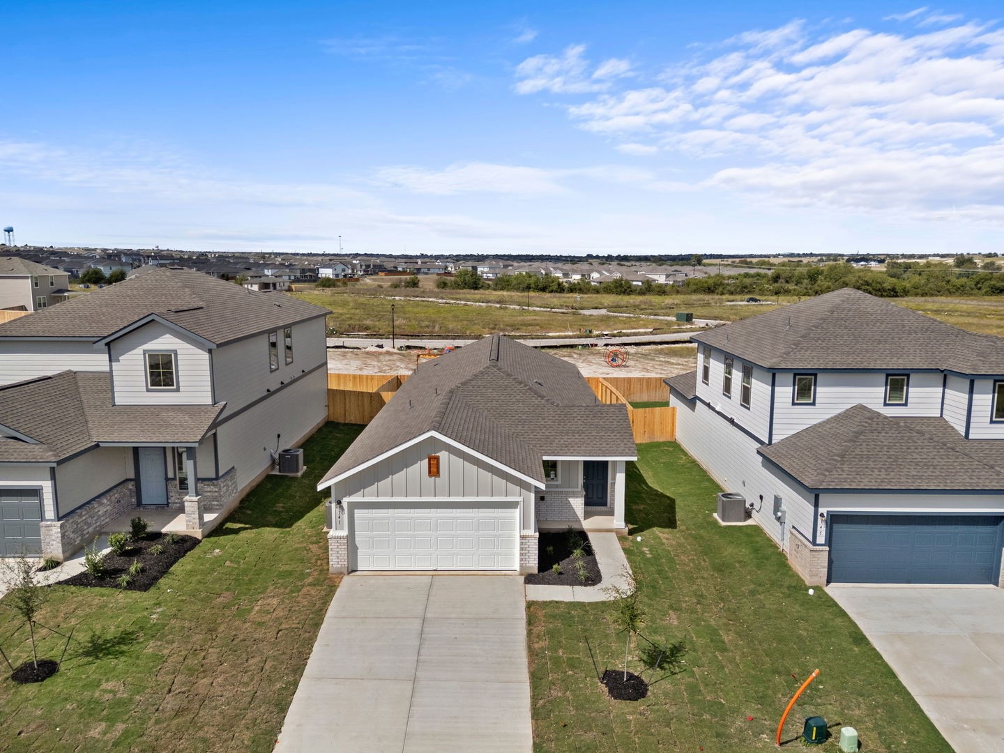 141 Hatari Trail Jarrell, TX 76537 - Photo 26 of 36 an aerial view of a house with a yard