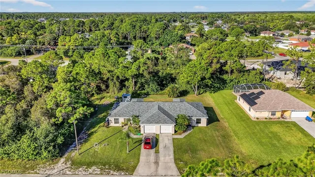 a view of a swimming pool with a yard