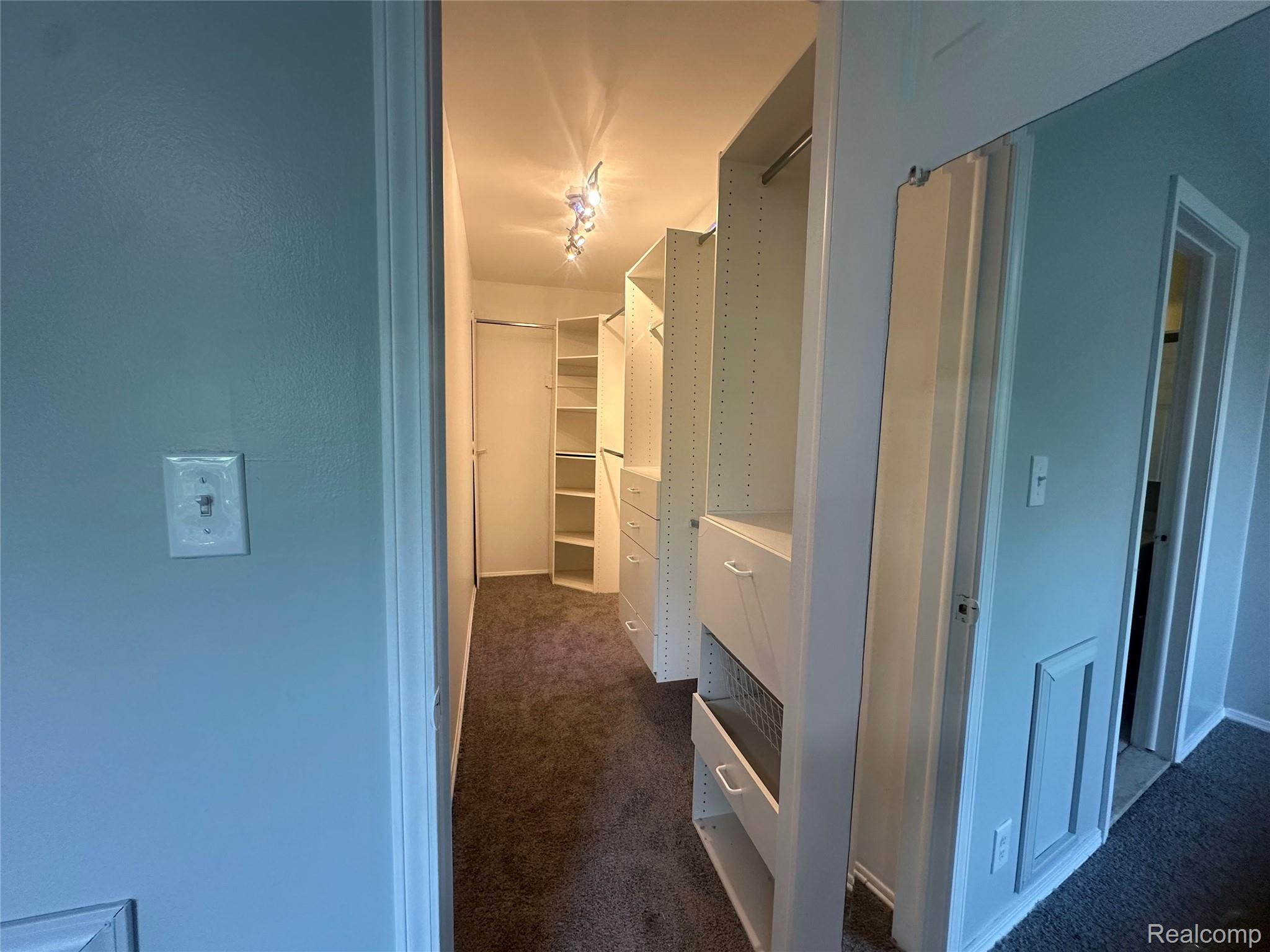 509 East University Drive Rochester, MI 48307 - Photo 11 of 20 Hallway featuring dark colored carpet