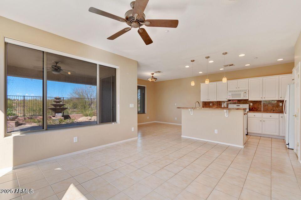 41526 North Cedar Chase Road Anthem, AZ 85086 - Photo 5 of 14 a view of a kitchen with a sink and a stove