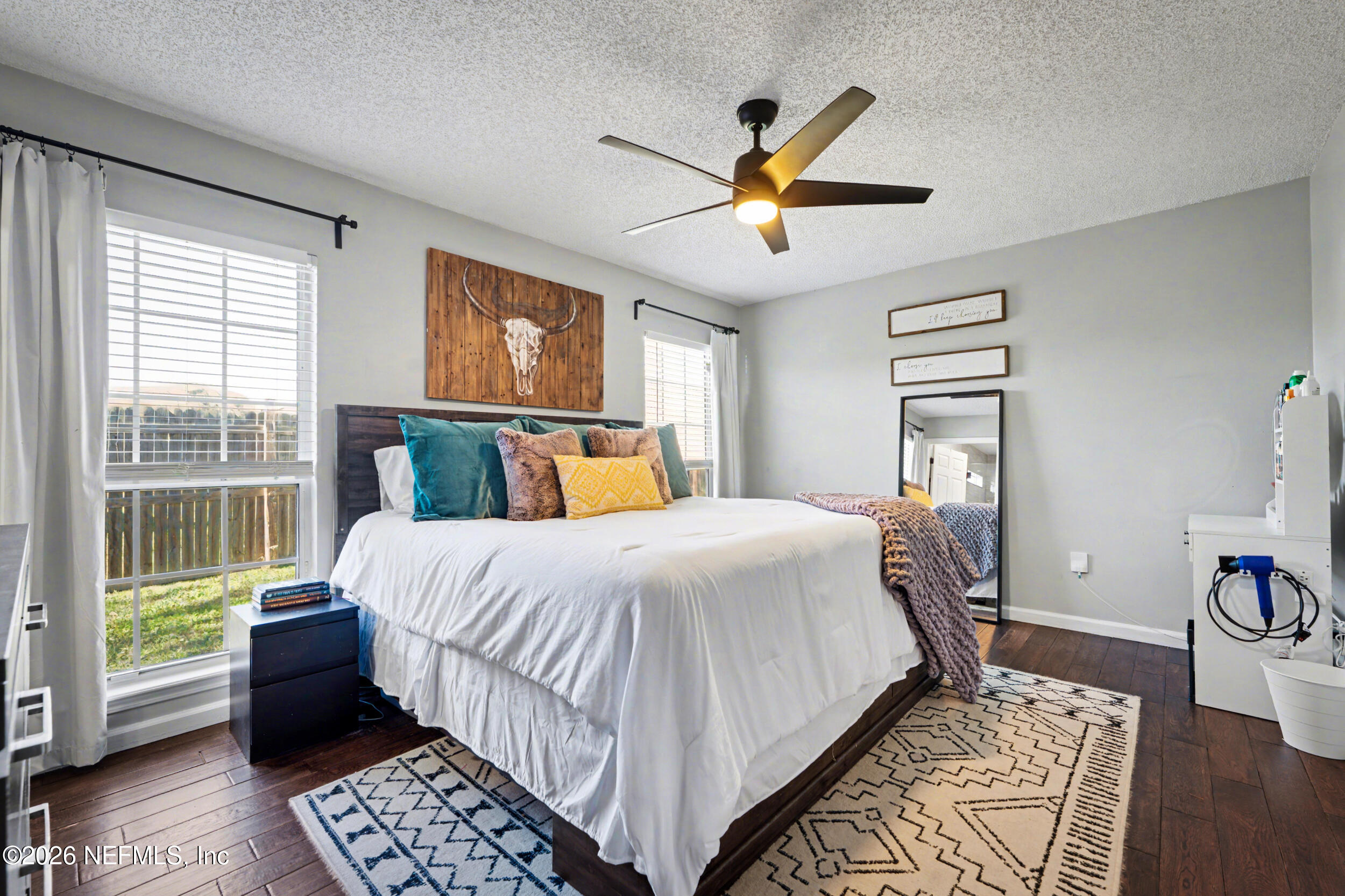 2992 Quapaw Trail Middleburg, FL 32068 - Photo 12 of 32 a bedroom with a large bed and a window