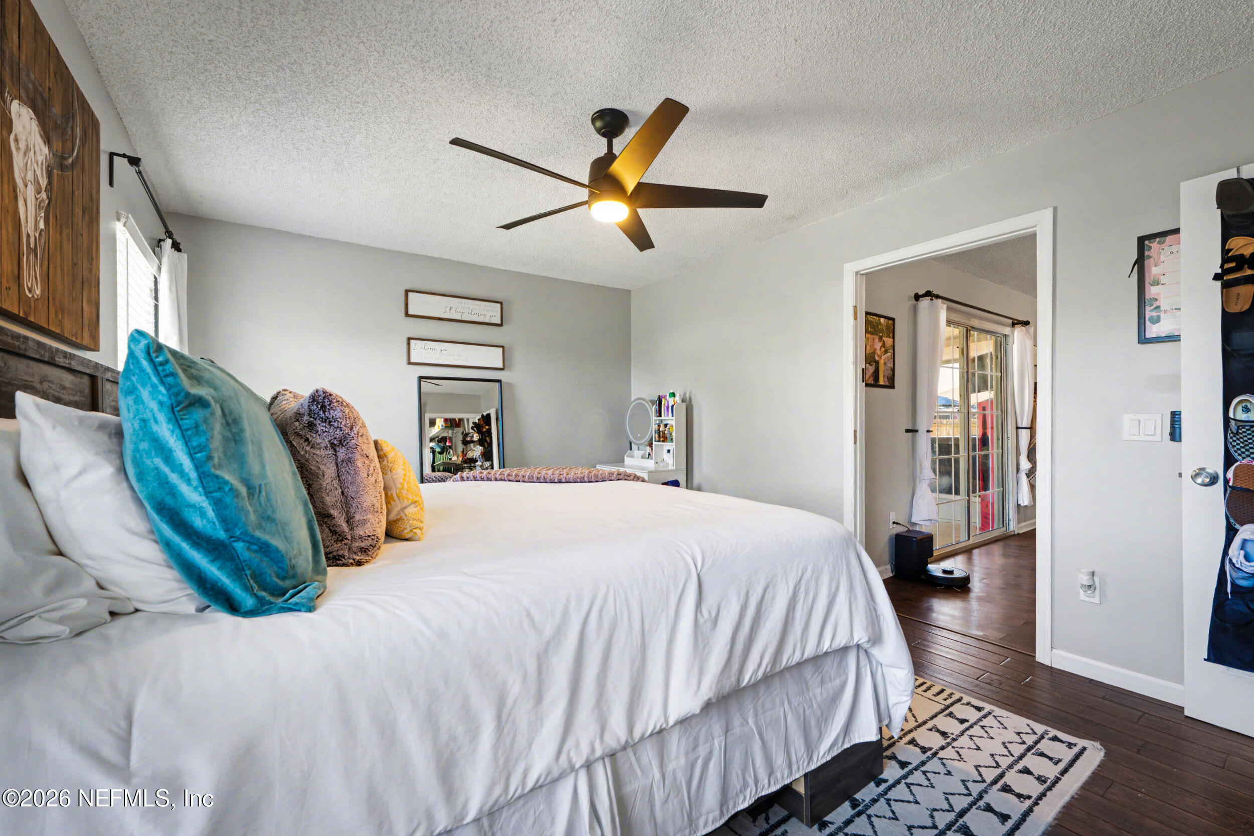 2992 Quapaw Trail Middleburg, FL 32068 - Photo 14 of 32 a bedroom with a bed and wooden floor