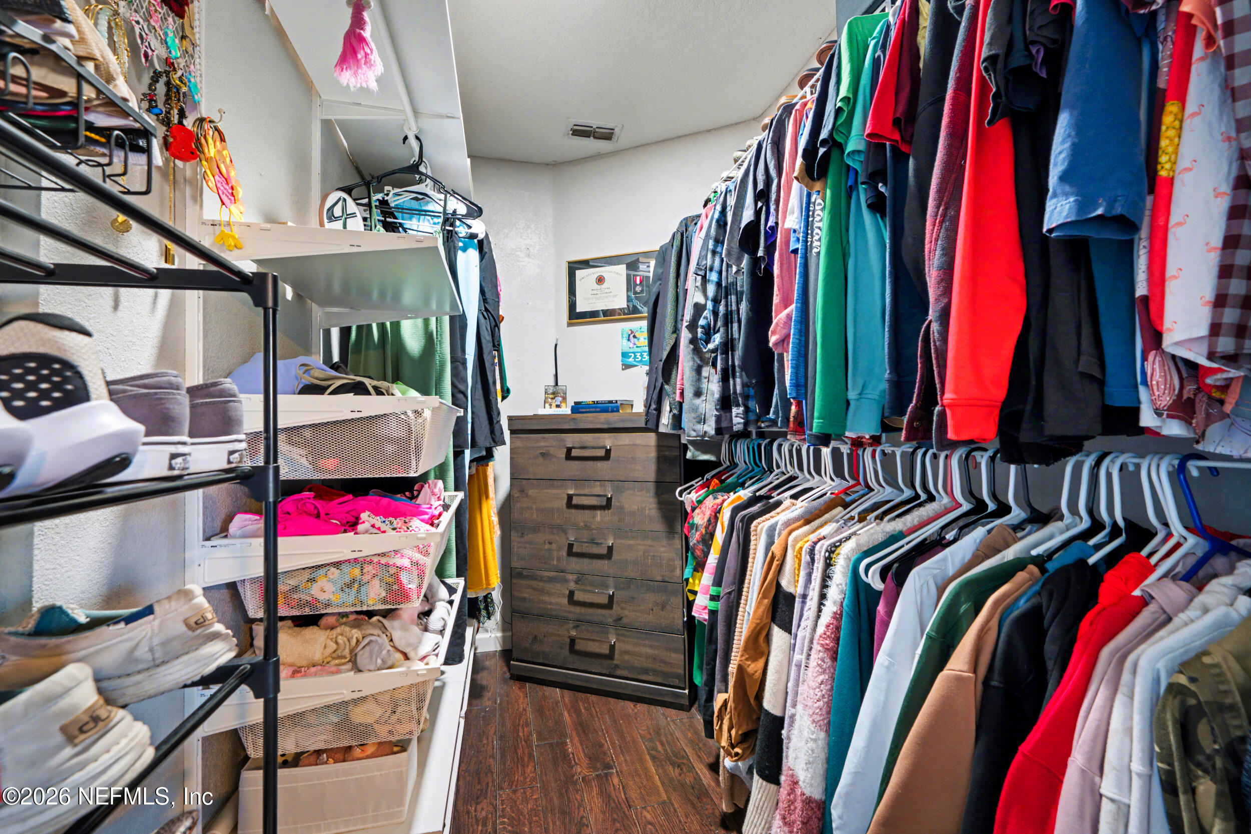 2992 Quapaw Trail Middleburg, FL 32068 - Photo 17 of 32 a view of walk in closet with clothes