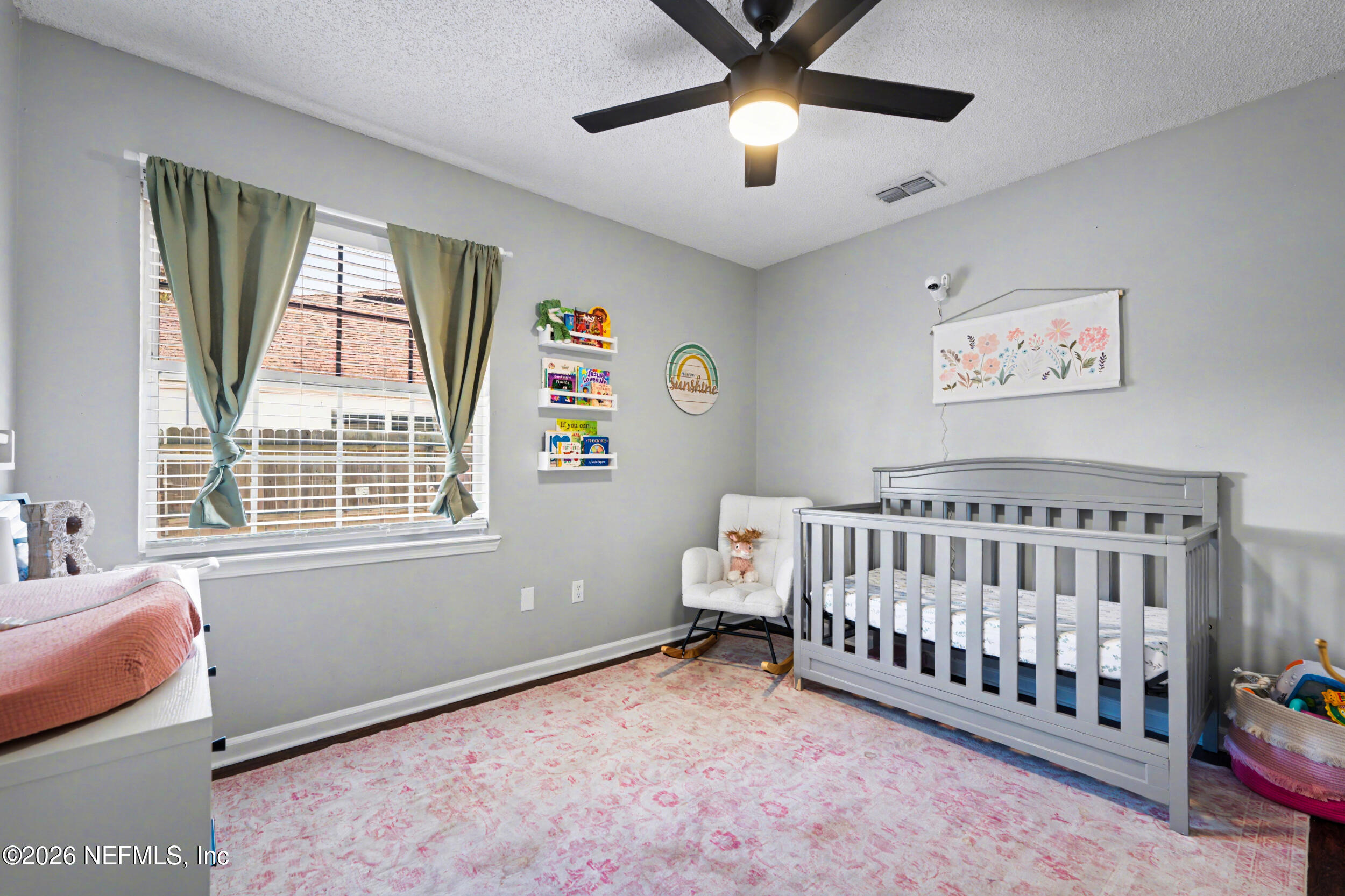 2992 Quapaw Trail Middleburg, FL 32068 - Photo 18 of 32 a bedroom with furniture and a window