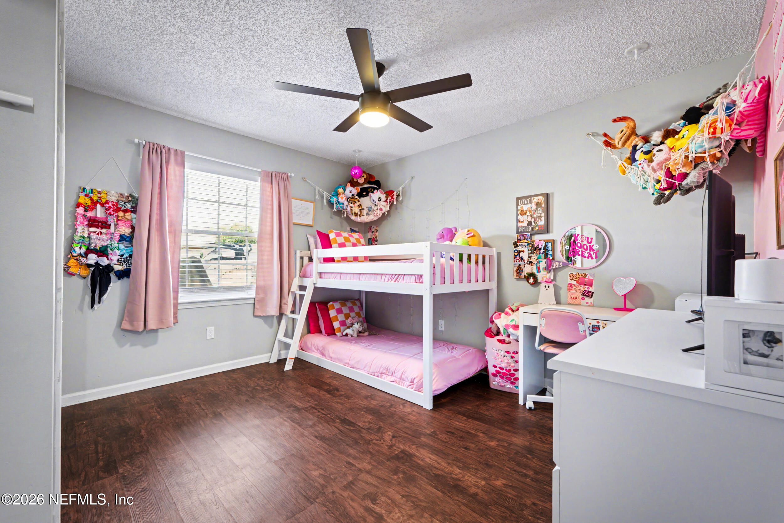 2992 Quapaw Trail Middleburg, FL 32068 - Photo 21 of 32 a bedroom with furniture a ceiling fan and a window