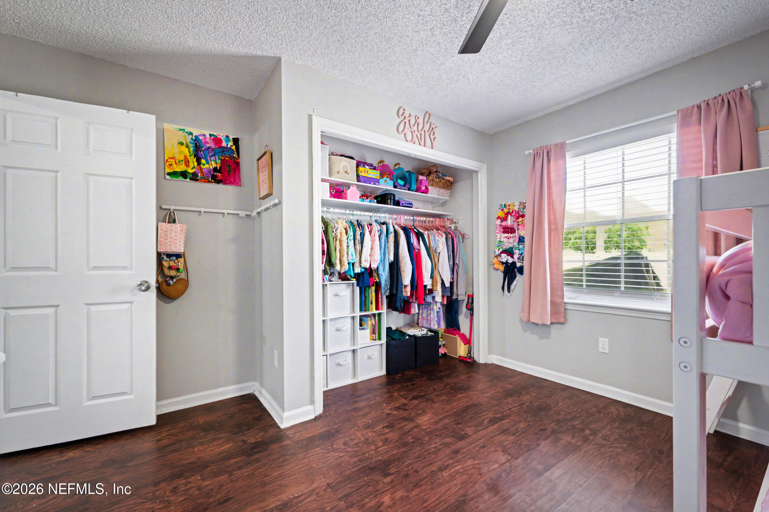 2992 Quapaw Trail Middleburg, FL 32068 - Photo 22 of 32 a view of a livingroom with wooden floor and a window