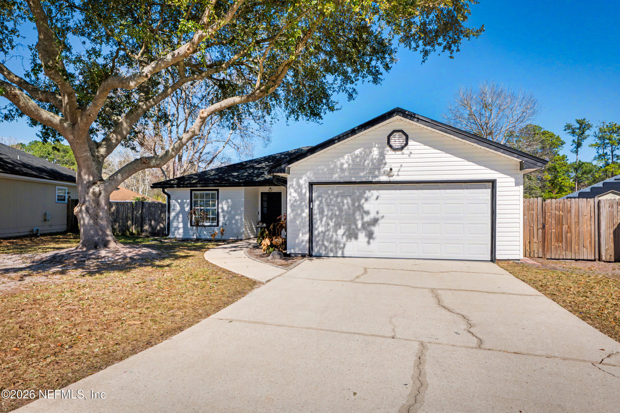 2992 Quapaw Trail Middleburg, FL 32068 - Photo 31 of 32 a front view of a house with a yard and garage