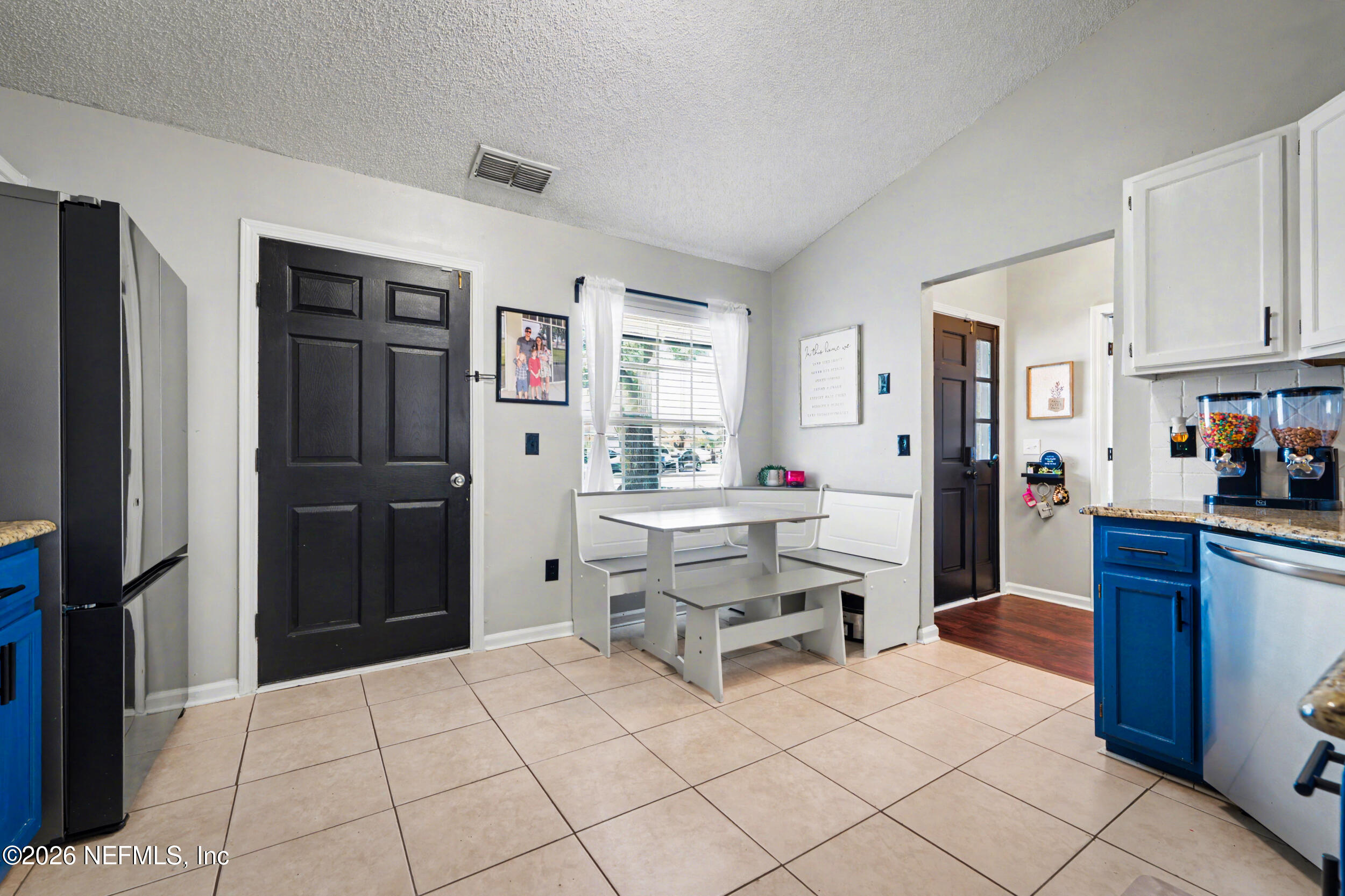 2992 Quapaw Trail Middleburg, FL 32068 - Photo 7 of 32 a kitchen with a refrigerator and cabinets
