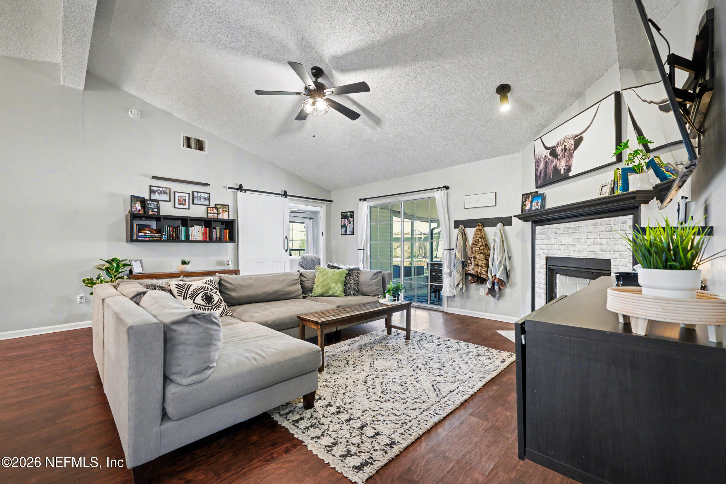2992 Quapaw Trail Middleburg, FL 32068 - Photo 8 of 32 a living room with furniture and a fireplace