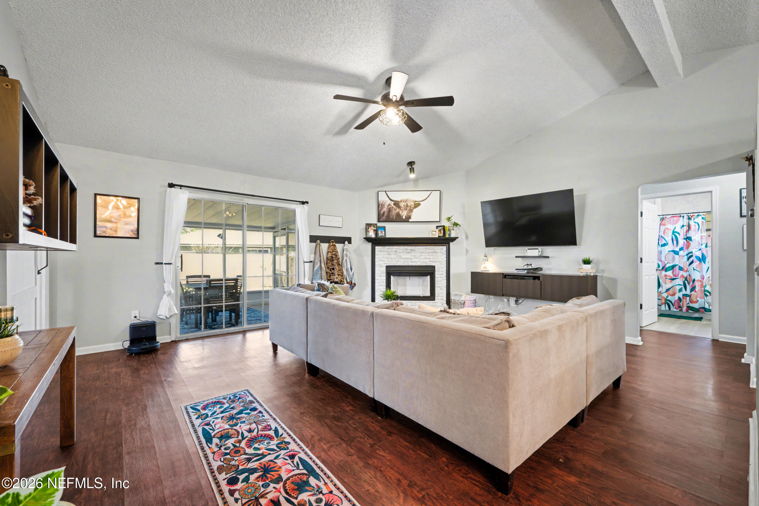 2992 Quapaw Trail Middleburg, FL 32068 - Photo 10 of 32 a living room with furniture and a flat screen tv