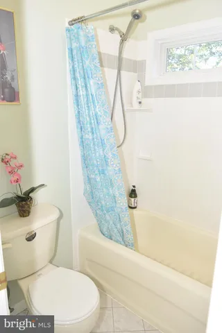 a view of a livingroom with furniture and a window