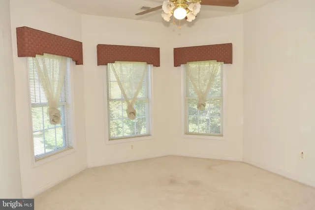 a view of a small space with wooden floor