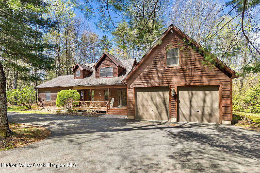 10 Old Farm Road Shokan, NY 12481 - Photo 2 of 68 a front view of a house with a garden and pathway