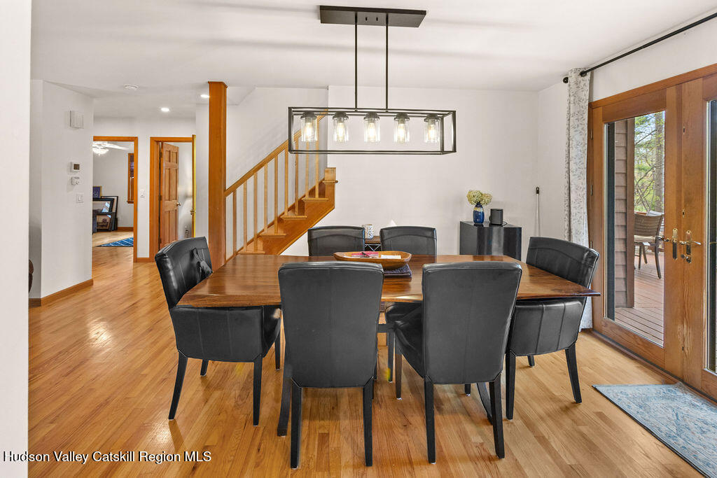 10 Old Farm Road Shokan, NY 12481 - Photo 24 of 68 a dining room with furniture a chandelier and wooden floor