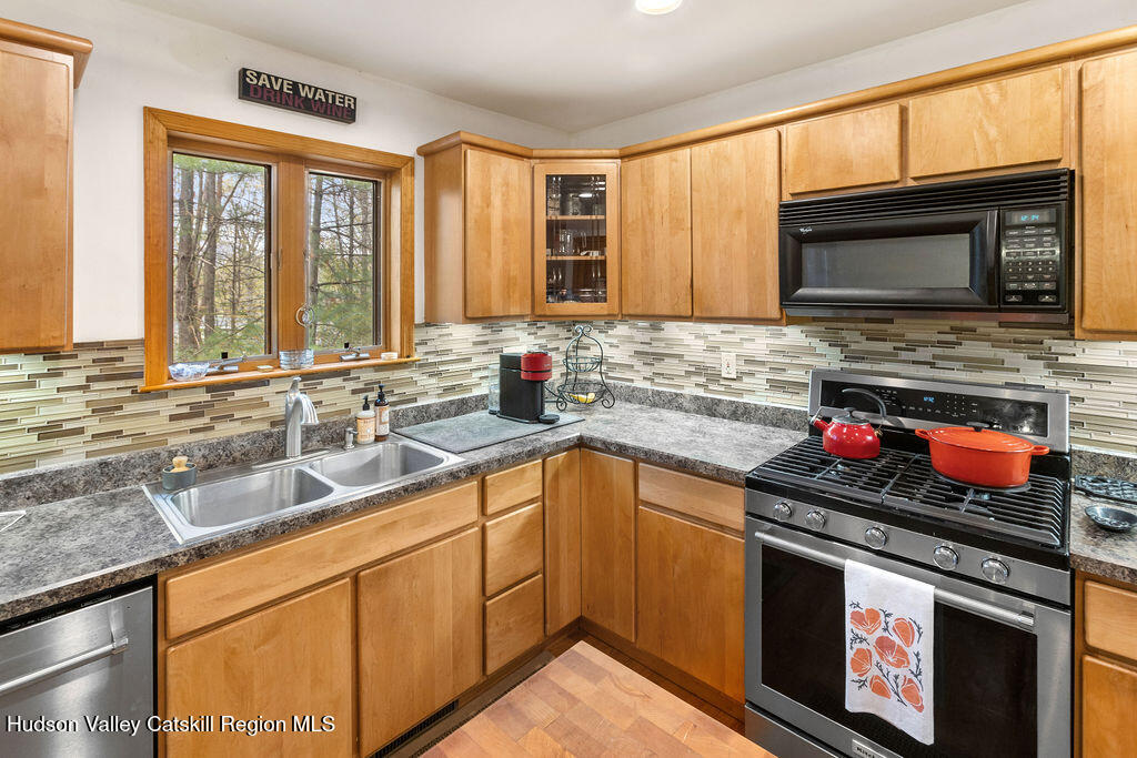 10 Old Farm Road Shokan, NY 12481 - Photo 43 of 68 a kitchen with stainless steel appliances a stove sink and cabinets