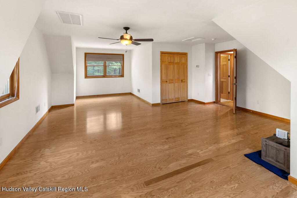 10 Old Farm Road Shokan, NY 12481 - Photo 53 of 68 a view of an empty room with window and wooden floor