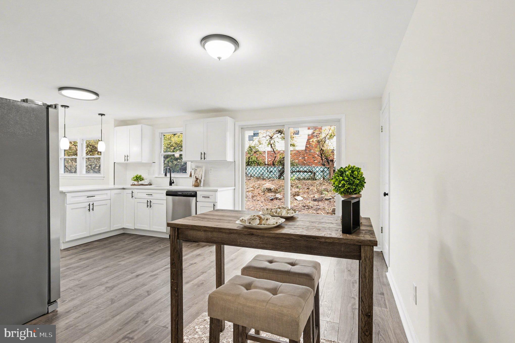 8029 Rider Avenue Towson, MD 21204 - Photo 11 of 41 a kitchen with a table and chairs in it