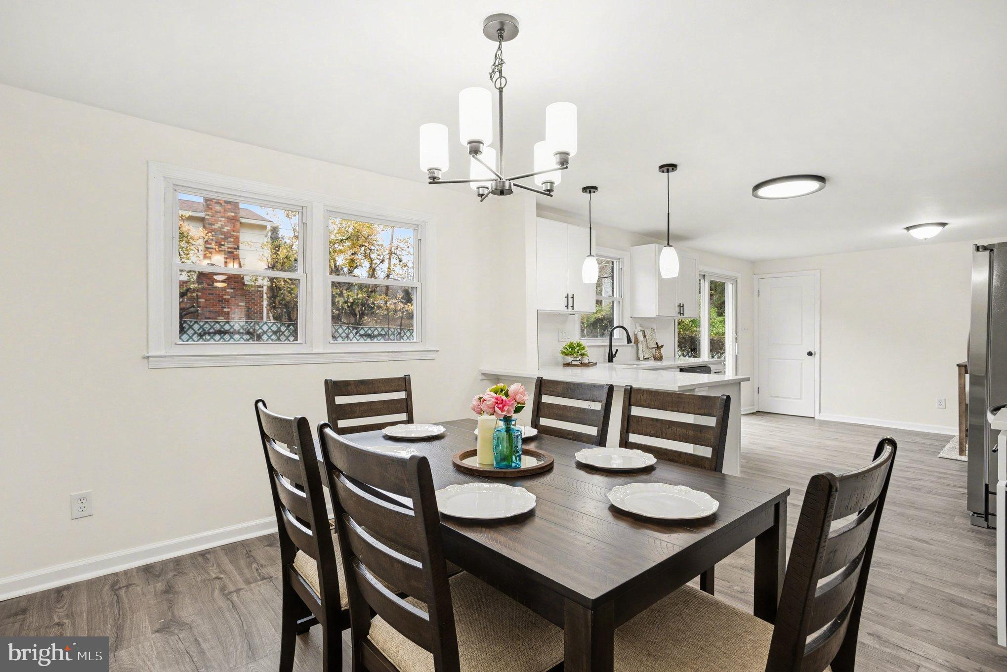 8029 Rider Avenue Towson, MD 21204 - Photo 17 of 41 a view of a dining room with furniture window and wooden floor