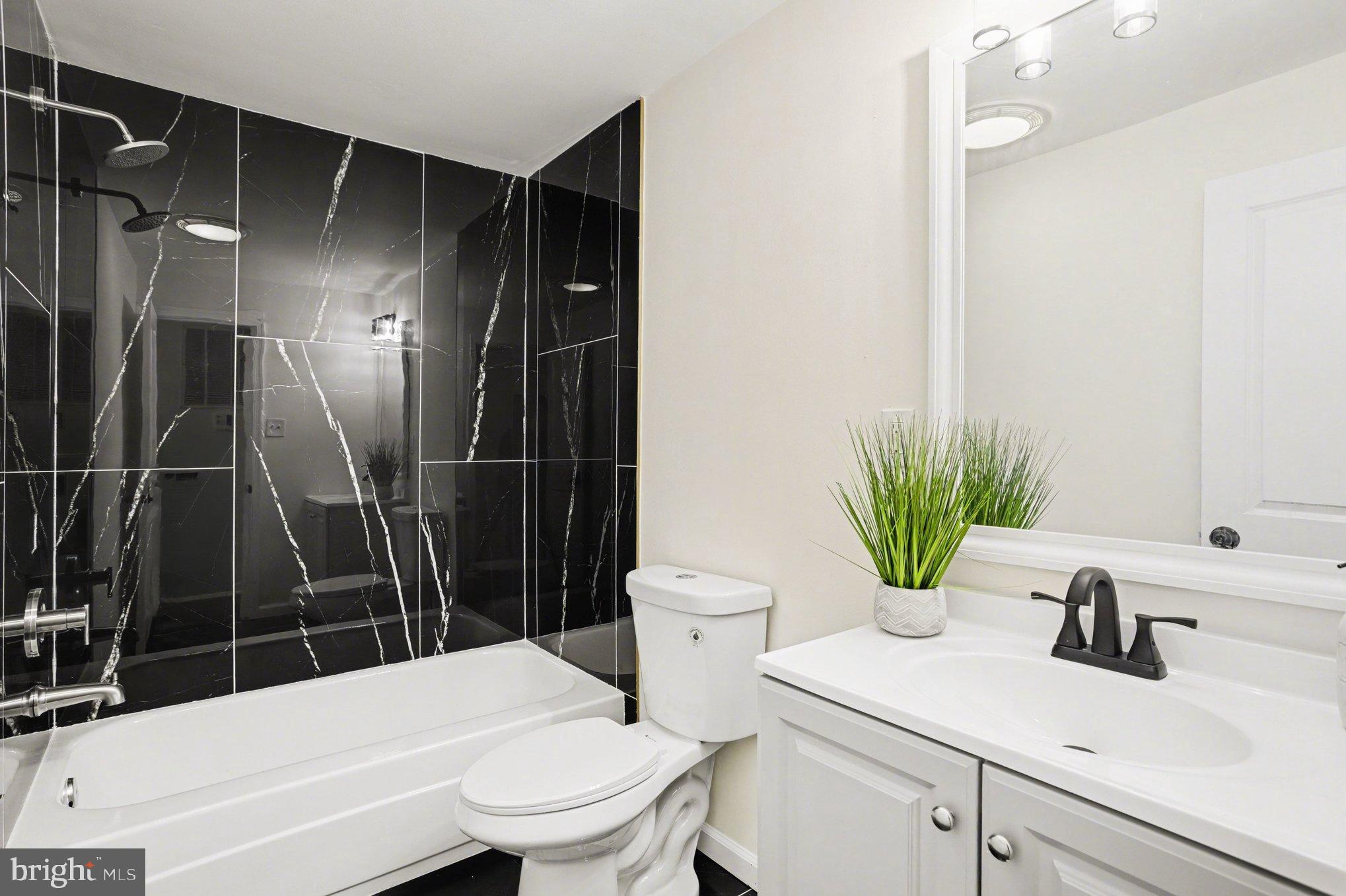 8029 Rider Avenue Towson, MD 21204 - Photo 18 of 41 a bathroom with a sink toilet and shower