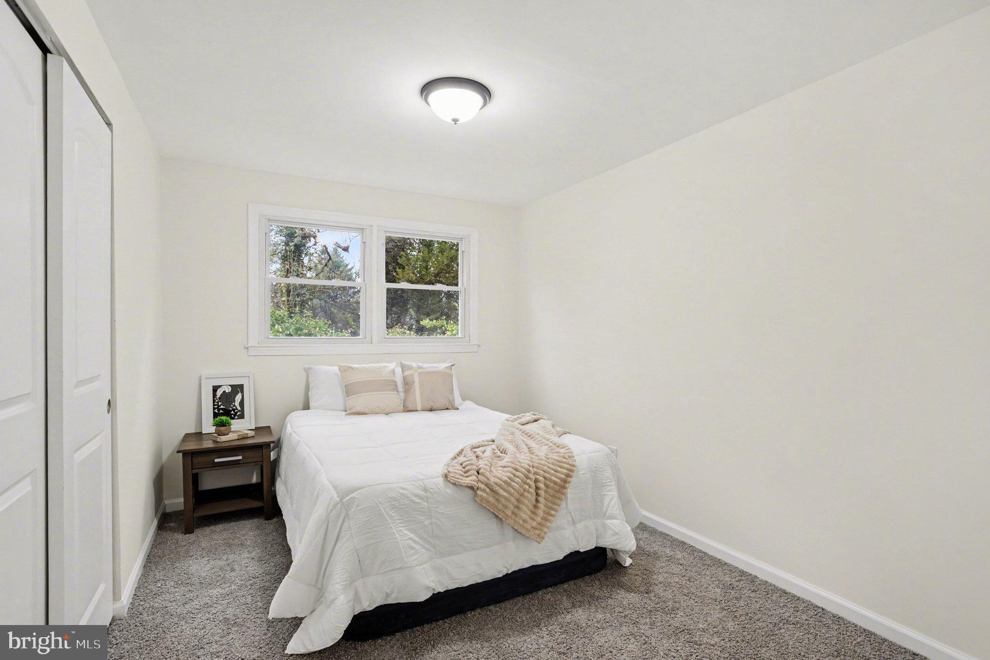 8029 Rider Avenue Towson, MD 21204 - Photo 19 of 41 a bedroom with a bed and a window