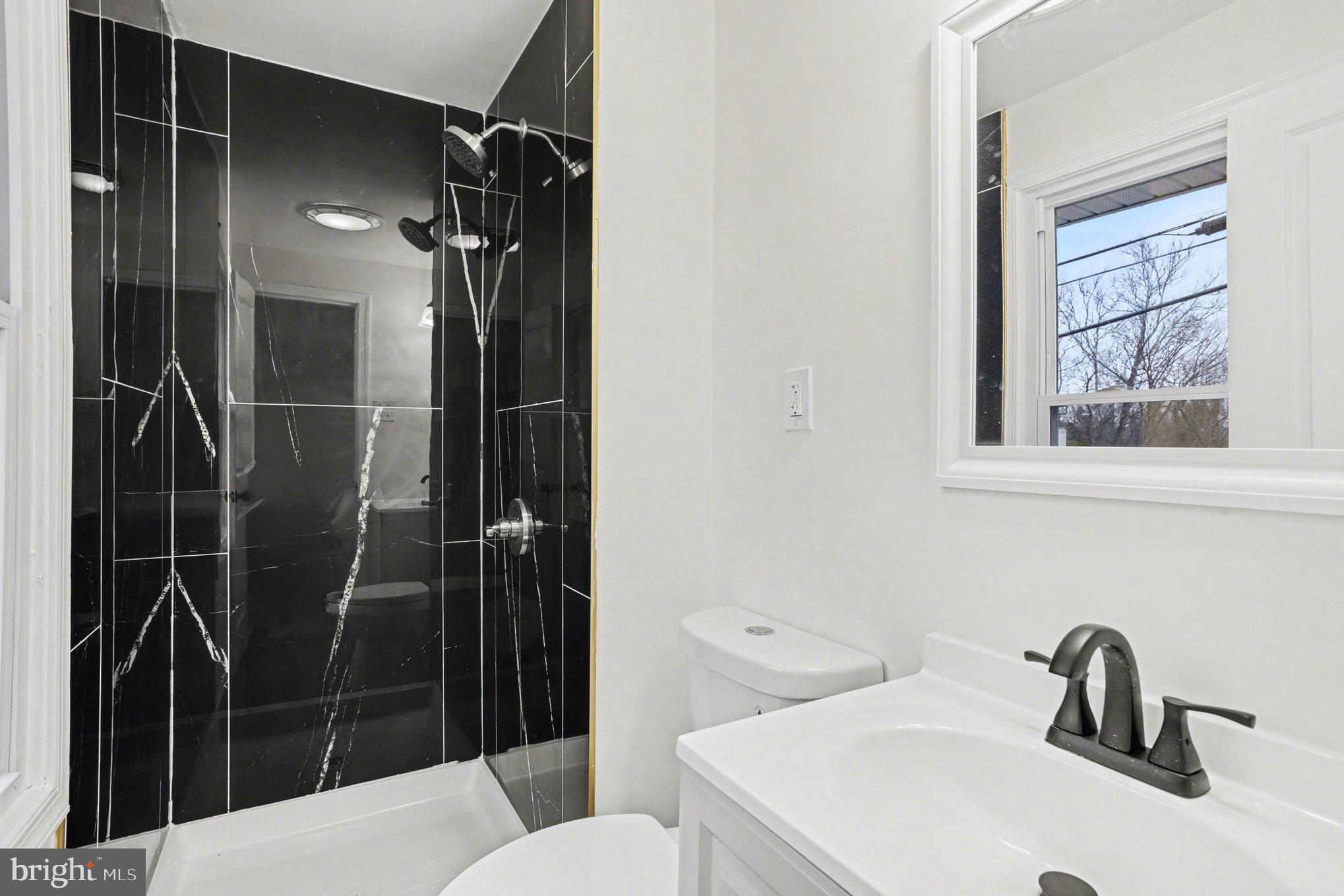 8029 Rider Avenue Towson, MD 21204 - Photo 23 of 41 a bathroom with a sink toilet and shower