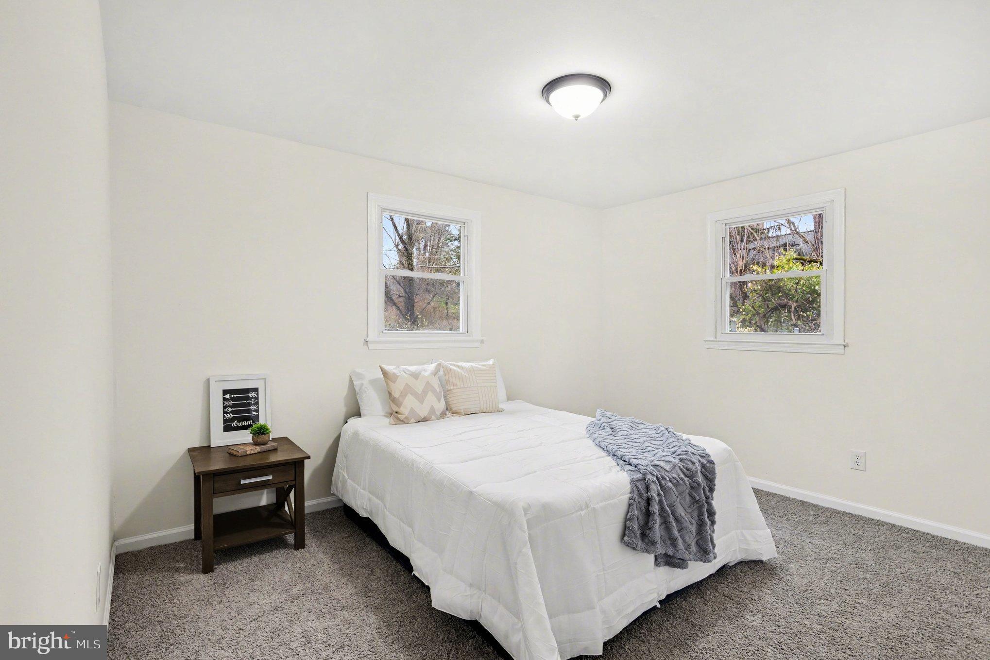 8029 Rider Avenue Towson, MD 21204 - Photo 25 of 41 a bedroom with a bed and wall painting