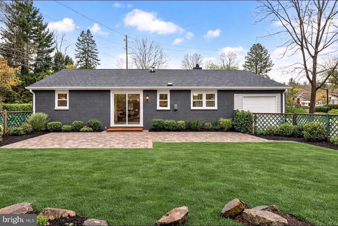 8029 Rider Avenue Towson, MD 21204 - Photo 39 of 41 a front view of a house with a yard and garage