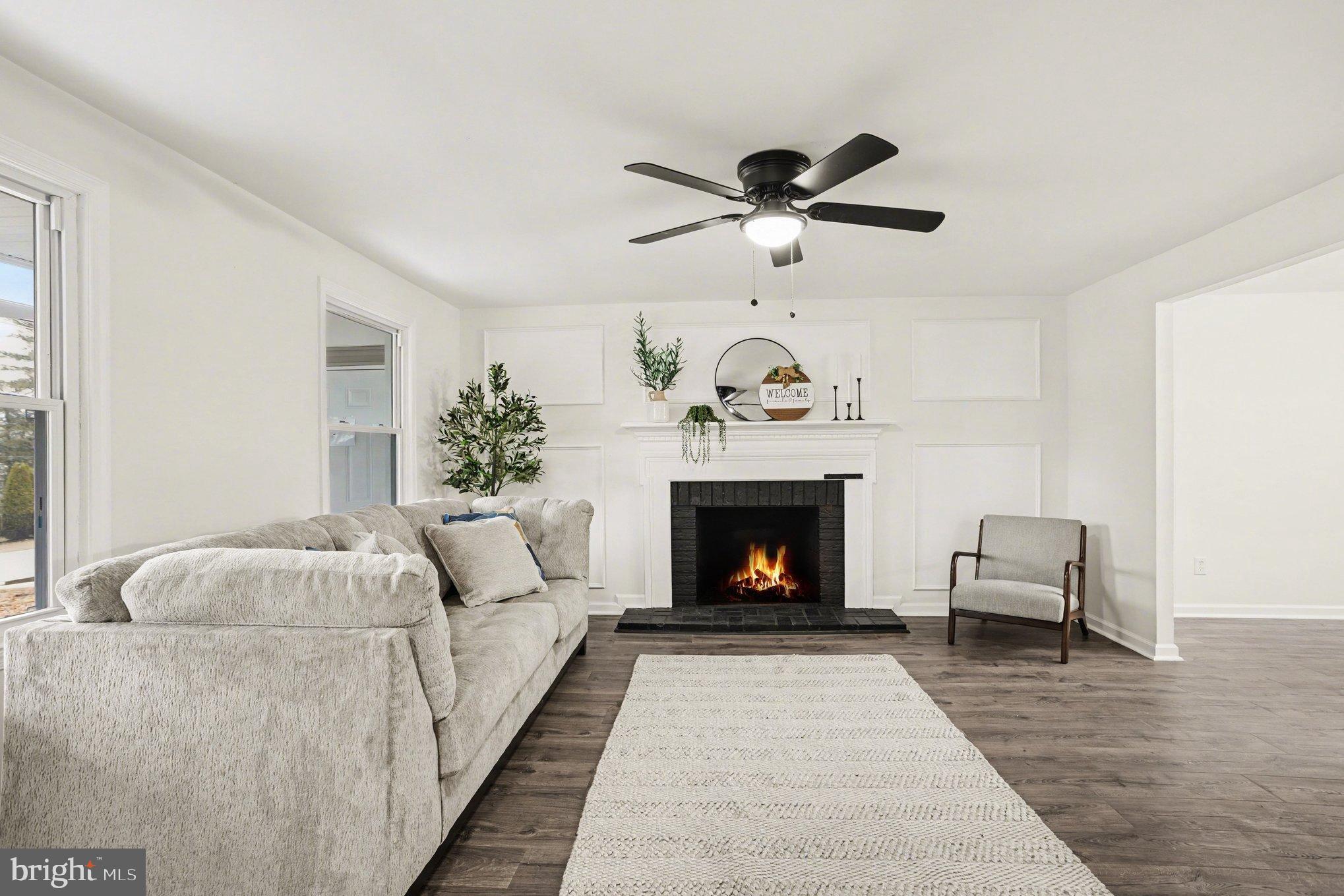 8029 Rider Avenue Towson, MD 21204 - Photo 8 of 41 a living room with furniture and a fireplace