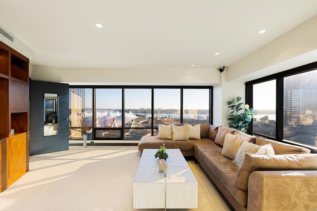 200 Harbor Drive, Unit 1502 San Diego, CA 92101 - Photo 15 of 48 a living room with furniture and a large window