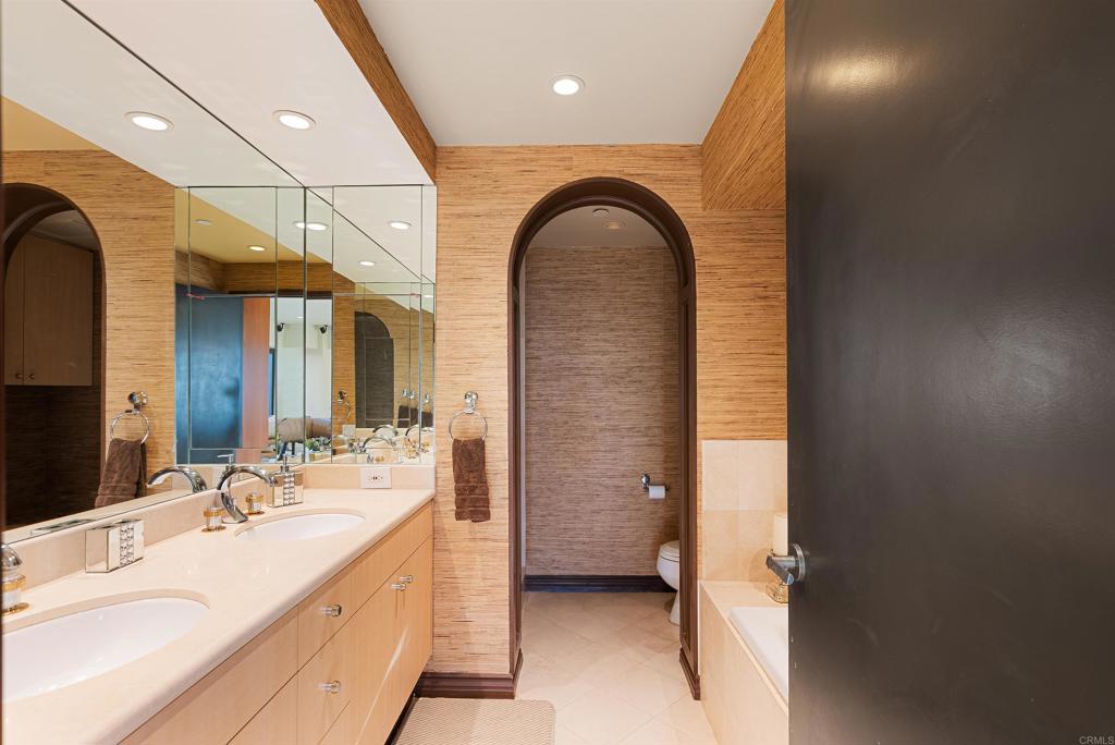 200 Harbor Drive, Unit 1502 San Diego, CA 92101 - Photo 16 of 48 a bathroom with a sink a toilet and shower