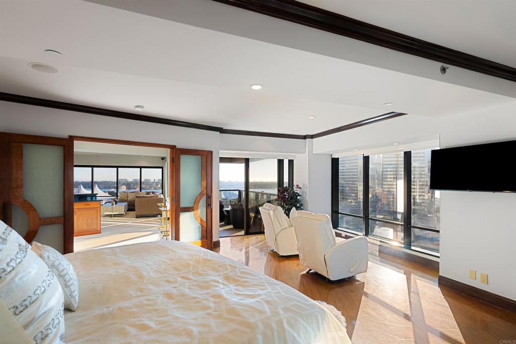 200 Harbor Drive, Unit 1502 San Diego, CA 92101 - Photo 18 of 48 a bedroom with a large bed and a large window