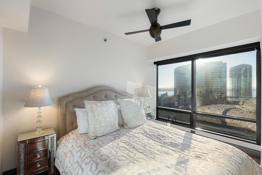 200 Harbor Drive, Unit 1502 San Diego, CA 92101 - Photo 24 of 48 a bedroom with a large bed and a chandelier