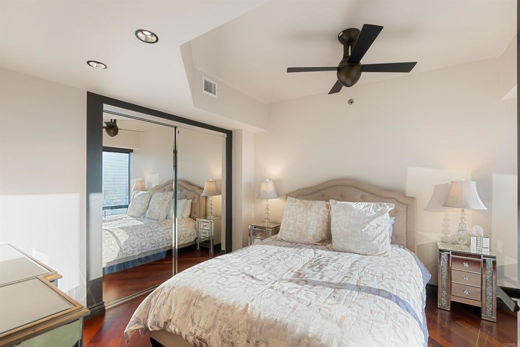 200 Harbor Drive, Unit 1502 San Diego, CA 92101 - Photo 25 of 48 a bedroom with a bed and a view of closet