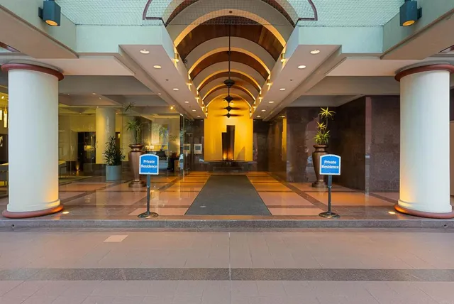 a view of a dining room with furniture water view and a large window