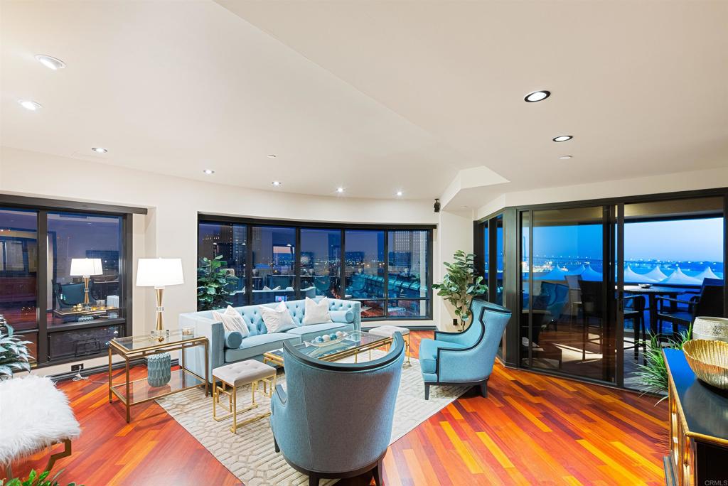 200 Harbor Drive, Unit 1502 San Diego, CA 92101 - Photo 40 of 48 a living room with furniture a table and a large window