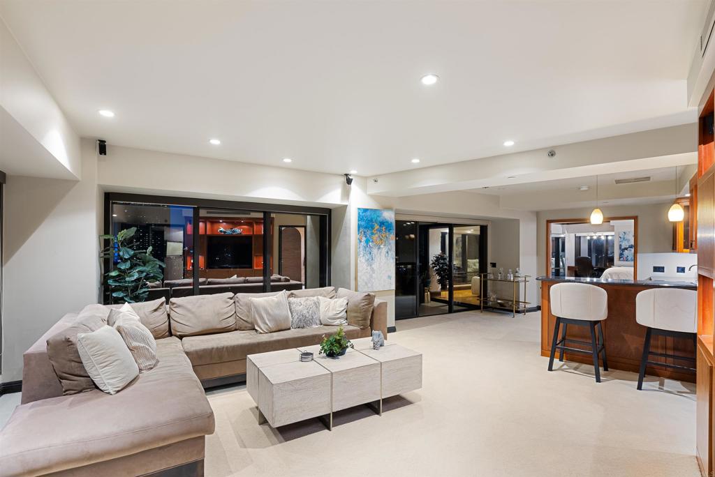 200 Harbor Drive, Unit 1502 San Diego, CA 92101 - Photo 44 of 48 a living room with furniture and a flat screen tv