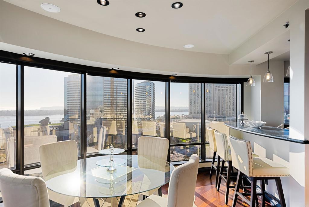 200 Harbor Drive, Unit 1502 San Diego, CA 92101 - Photo 5 of 48 a dining room with furniture and large windows