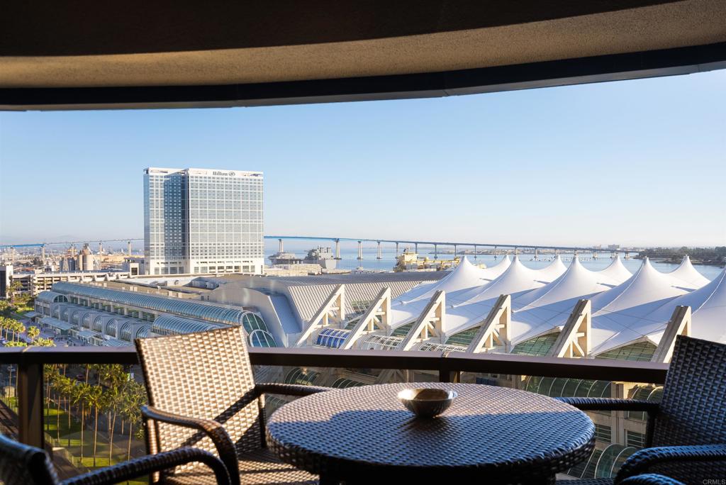 200 Harbor Drive, Unit 1502 San Diego, CA 92101 - Photo 9 of 48 a dining room with a table and chairs