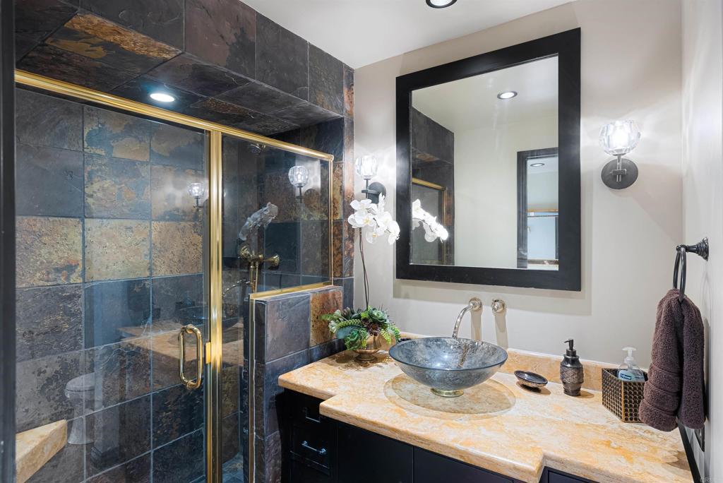 200 Harbor Drive, Unit 1502 San Diego, CA 92101 - Photo 10 of 48 a bathroom with a sink and a mirror